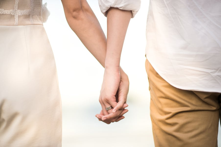 Couple holding hands